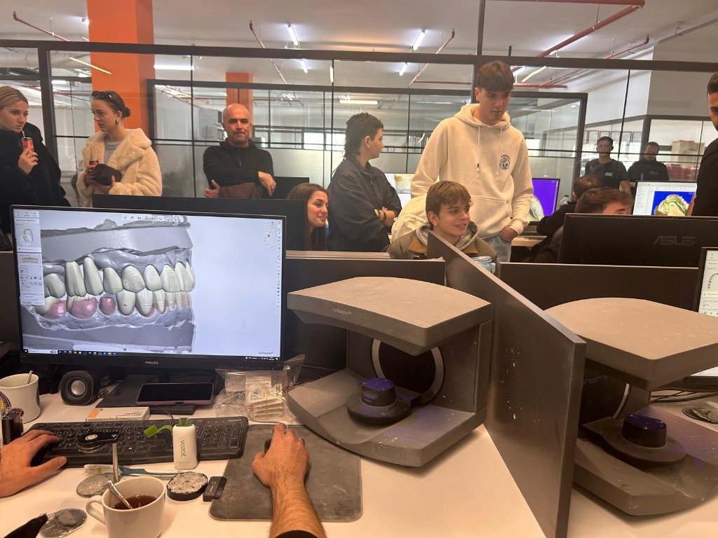 Students examining dental software